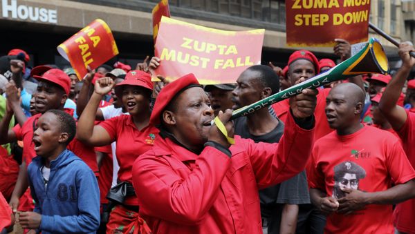 Protesters hold placards as they march in South AfricaÕs capital to protest against President Jacob Zuma in Pretoria, South Africa, April 12 ,2017 - Sputnik International