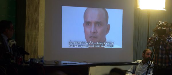 In this photograph taken on March 29, 2016, Pakistani journalists watch a video showing Indian national Kulbhushan Yadav, arrested on suspicion of spying, during a press conference in Islamabad - Sputnik International