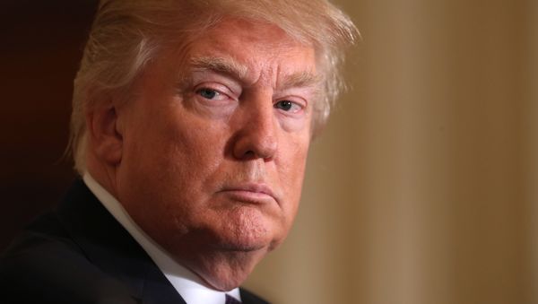 President Donald Trump listens during a news conference with NATO Secretary General Jens Stoltenberg in the East Room of the White House in Washington, Wednesday, April 12, 2017. President Donald Trump listens during a news conference with NATO Secretary General Jens Stoltenberg in the East Room of the White House in Washington, Wednesday, April 12, 2017. - Sputnik International