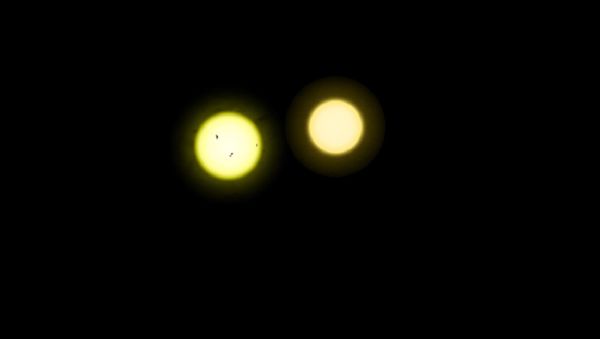 The Sun (left) is both larger and somewhat hotter than the less active Tau Ceti (right) The Sun (left) is both larger and somewhat hotter than the less active Tau Ceti (right) - Sputnik International