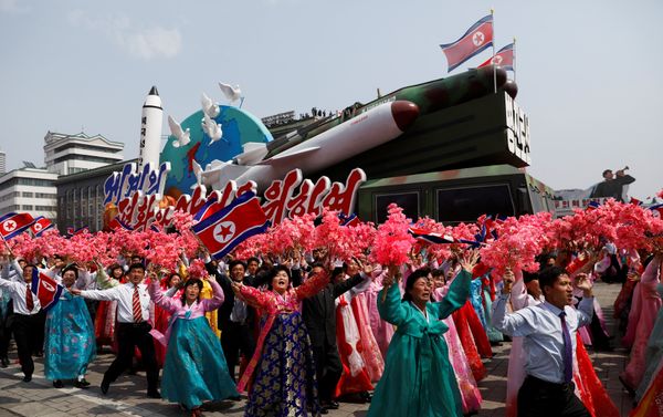 People react as they march past the stand with North Korean leader Kim Jong Un during a military parade marking the 105th birth anniversary of the country's founding father Kim Il Sung, in Pyongyang, April 15, 2017. - Sputnik International