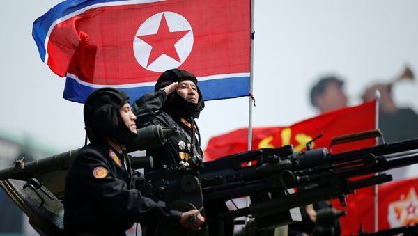 A soldier salutes atop an armoured vehicle as it drives past the stand with North Korean leader Kim Jong Un during a military parade marking the 105th birth anniversary of country's founding father, Kim Il Sung, in Pyongyang April 15, 2017. - Sputnik International