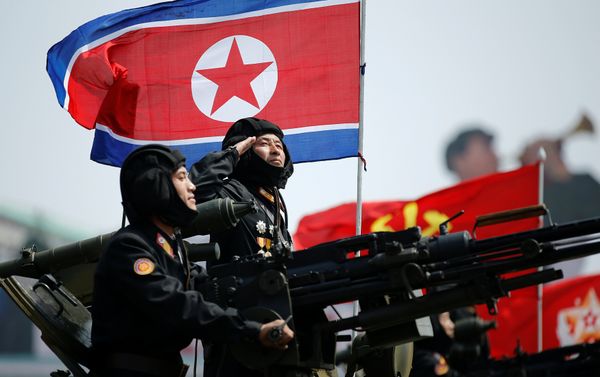 A soldier salutes atop an armoured vehicle as it drives past the stand with North Korean leader Kim Jong Un during a military parade marking the 105th birth anniversary of country's founding father, Kim Il Sung, in Pyongyang April 15, 2017. - Sputnik International