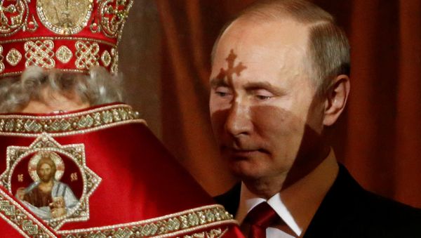 Russian President Vladimir Putin attends the Orthodox Easter service at the Christ the Saviour Cathedral in Moscow, Russia, early April 16, 2017. Russian President Vladimir Putin attends the Orthodox Easter service at the Christ the Saviour Cathedral in Moscow, Russia, early April 16, 2017. - Sputnik International