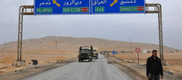 A picture taken on March 2, 2017, shows a sign displaying the routes to Palmyra-Deir Ezzor and Damascus-Iraq A picture taken on March 2, 2017, shows a sign displaying the routes to Palmyra-Deir Ezzor and Damascus-Iraq - Sputnik International