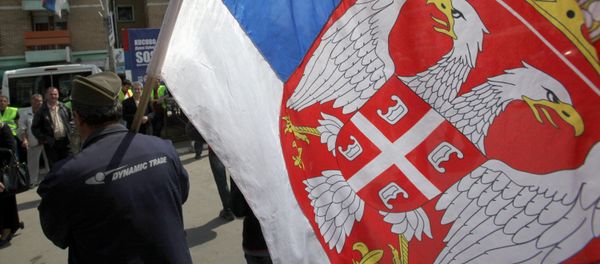 Kosovo Serb caring Serbian flag during the protest against recognition of Kosovo as an independent state, in the northern Serb-dominated part of the ethnically divided town of Mitrovica, Kosovo, Monday, April 22, 2013 Kosovo Serb caring Serbian flag during the protest against recognition of Kosovo as an independent state, in the northern Serb-dominated part of the ethnically divided town of Mitrovica, Kosovo, Monday, April 22, 2013 - Sputnik International