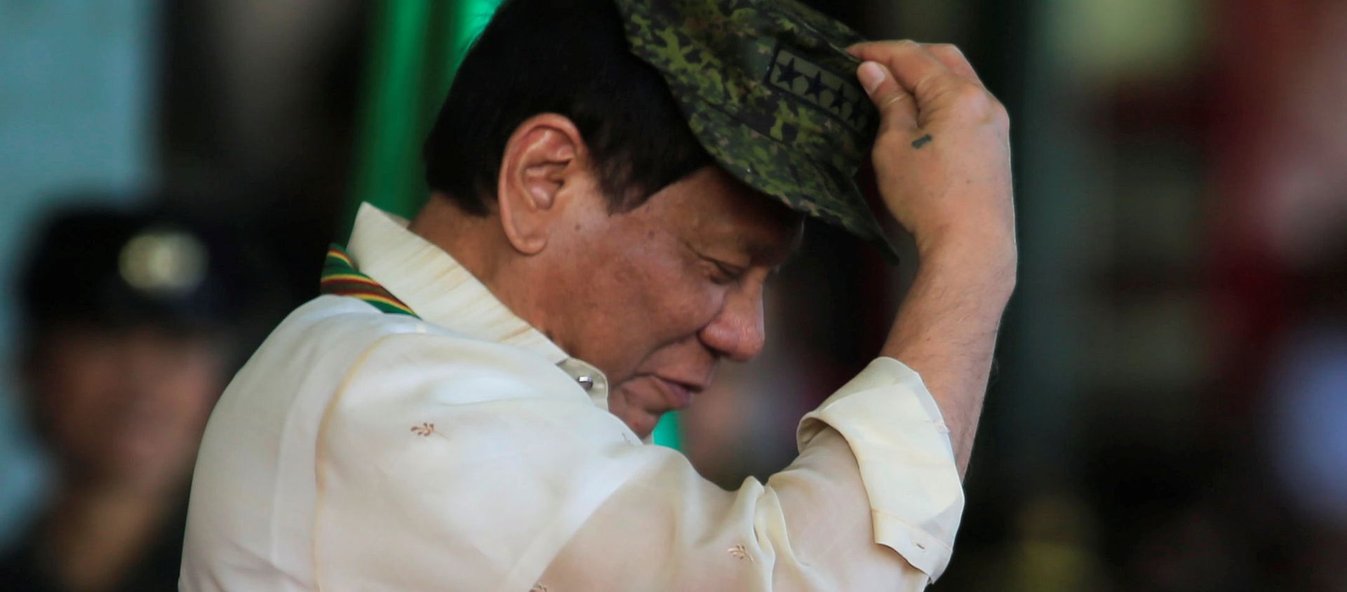 Philippine President Rodrigo Duterte tries on a military hat given to him during the 120th founding anniversary of the Philippine Army (PA) at Taguig city, metro Manila, Philippines, 4 April 2017 Philippine President Rodrigo Duterte tries on a military hat given to him during the 120th founding anniversary of the Philippine Army (PA) at Taguig city, metro Manila, Philippines, 4 April 2017 - Sputnik International, 1920, 06.03.2021