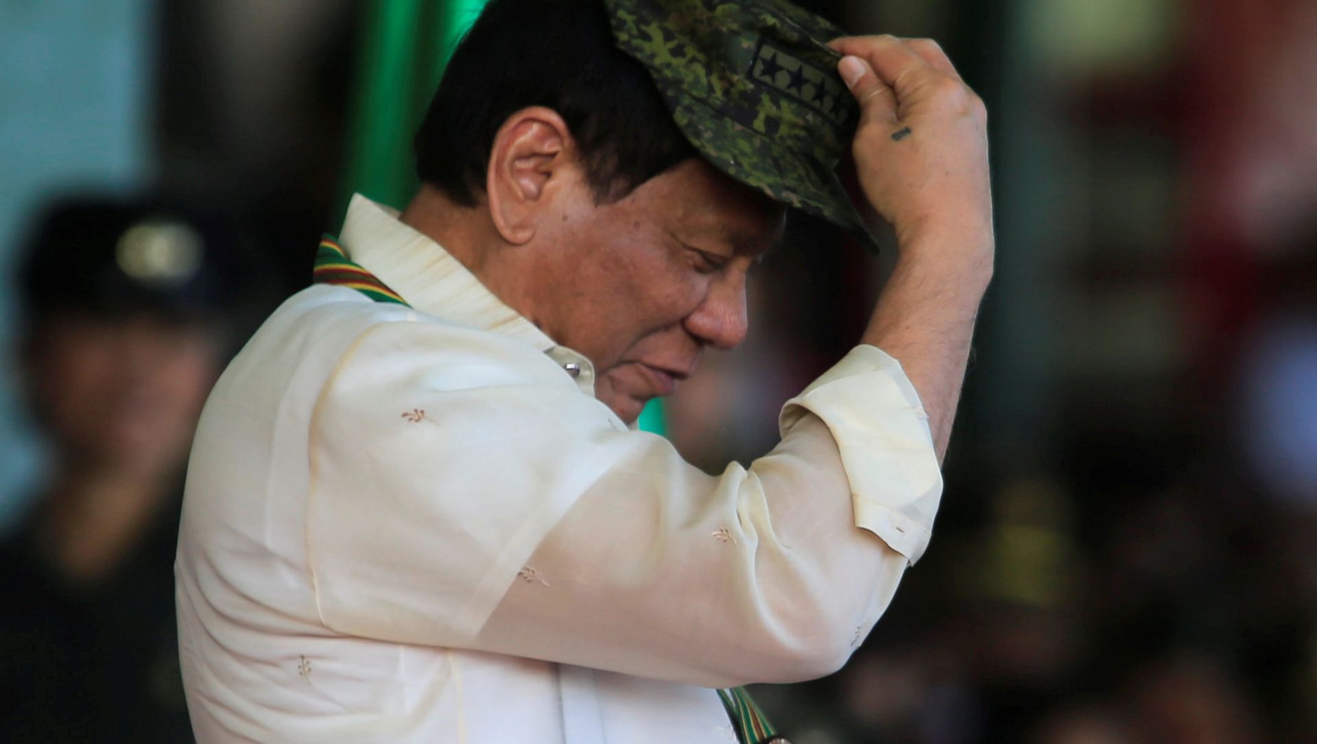 Philippine President Rodrigo Duterte tries on a military hat given to him during the 120th founding anniversary of the Philippine Army (PA) at Taguig city, metro Manila, Philippines, 4 April 2017 Philippine President Rodrigo Duterte tries on a military hat given to him during the 120th founding anniversary of the Philippine Army (PA) at Taguig city, metro Manila, Philippines, 4 April 2017 - Sputnik International, 1920, 06.03.2021