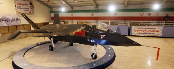 Iran's domestically designed and built Qaher (Conqueror) F-313 fighter jet is unveiled during a ceremony in a warehouse in Tehran on February 2, 2013 - Sputnik International