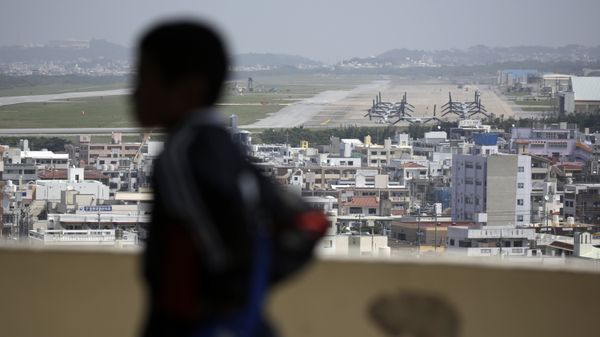 a child looks at the U.S. Marine Corps Futenma Air Station and the surrounding area from an observation deck at a park in Ginowan, Okinawa Prefecture on southern Japan. a child looks at the U.S. Marine Corps Futenma Air Station and the surrounding area from an observation deck at a park in Ginowan, Okinawa Prefecture on southern Japan. - Sputnik International