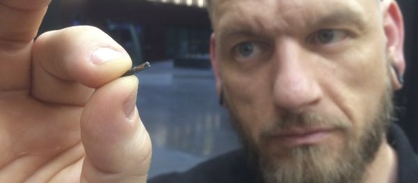 Self-described “body hacker” Jowan Osterlund from Biohax Sweden, holds a small microchip implant, similar to those implanted into workers at the Epicenter digital innovation business centre during a party at the co-working space in central Stockholm, Tuesday March 14, 2017 Self-described “body hacker” Jowan Osterlund from Biohax Sweden, holds a small microchip implant, similar to those implanted into workers at the Epicenter digital innovation business centre during a party at the co-working space in central Stockholm, Tuesday March 14, 2017 - Sputnik International