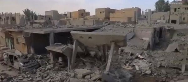 A still image taken from a video released on the internet by Islamic State-affiliated Amaq News Agency, on April 18, 2017, purports to show the aftermath, said to be in al-Bukamal town, in Deir al-Zor province, after air strikes thought to have been directed by planes from a U.S.-led military coalition, Syria A still image taken from a video released on the internet by Islamic State-affiliated Amaq News Agency, on April 18, 2017, purports to show the aftermath, said to be in al-Bukamal town, in Deir al-Zor province, after air strikes thought to have been directed by planes from a U.S.-led military coalition, Syria - Sputnik International