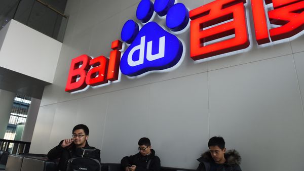 People sit below a Baidu logo at the Baidu headquarters in Beijing on December 17, 2014. People sit below a Baidu logo at the Baidu headquarters in Beijing on December 17, 2014. - Sputnik International