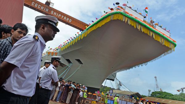 Indian naval officers stand guard during the launch of the indigenously-built aircraft carrier INS Vikrant at the Cochin Shipyard in Kochi on August 12, 2013 Indian naval officers stand guard during the launch of the indigenously-built aircraft carrier INS Vikrant at the Cochin Shipyard in Kochi on August 12, 2013 - Sputnik International