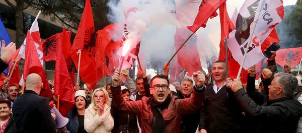Supporters of the Albanian opposition shout anti-Government slogans as they protest in front of the government building in Tirana on February 18, 2017 Supporters of the Albanian opposition shout anti-Government slogans as they protest in front of the government building in Tirana on February 18, 2017 - Sputnik International