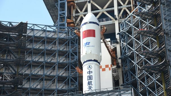 Long March-7 rocket and Tianzhou-1 cargo spacecraft are seen as they are transferred to a launching spot in Wenchang, Hainan province, China, April 17, 2017 - Sputnik International