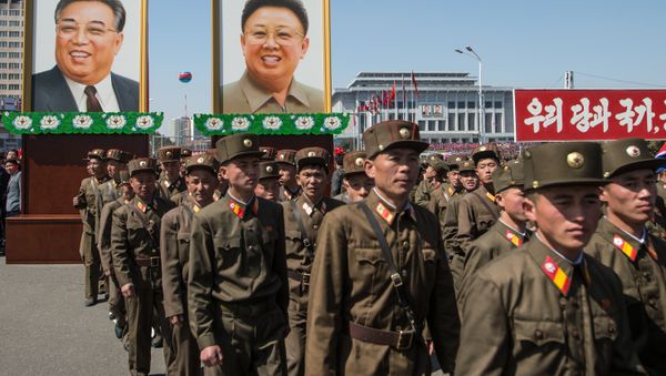 Portraits of Kim Il-sung and Kim Jong-il at a ceremony to open a new residential area on Ryomyong Street in Pyongyang. Portraits of Kim Il-sung and Kim Jong-il at a ceremony to open a new residential area on Ryomyong Street in Pyongyang. - Sputnik International