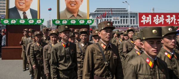 Portraits of Kim Il-sung and Kim Jong-il at a ceremony to open a new residential area on Ryomyong Street in Pyongyang. - Sputnik International