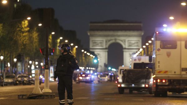 A police officer stands guard after a fatal shooting on the Champs Elysees in Paris, France, Thursday, April 20, 2017. A police officer stands guard after a fatal shooting on the Champs Elysees in Paris, France, Thursday, April 20, 2017. - Sputnik International