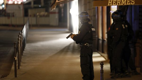 Police officers take positions near the Champs Elysees avenue in Paris, France, after a fatal shooting in which a police officer was killed along with an attacker, Thursday, April 20, 2017. Police officers take positions near the Champs Elysees avenue in Paris, France, after a fatal shooting in which a police officer was killed along with an attacker, Thursday, April 20, 2017. - Sputnik International