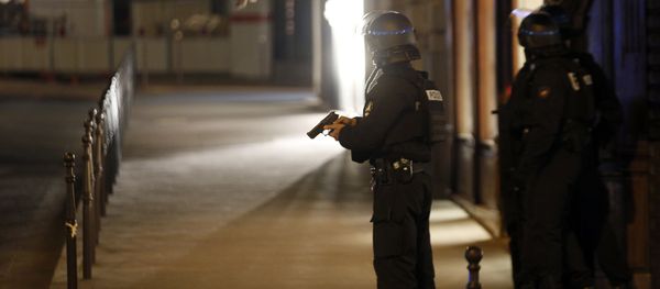 Police officers take positions near the Champs Elysees avenue in Paris, France, after a fatal shooting in which a police officer was killed along with an attacker, Thursday, April 20, 2017. - Sputnik International
