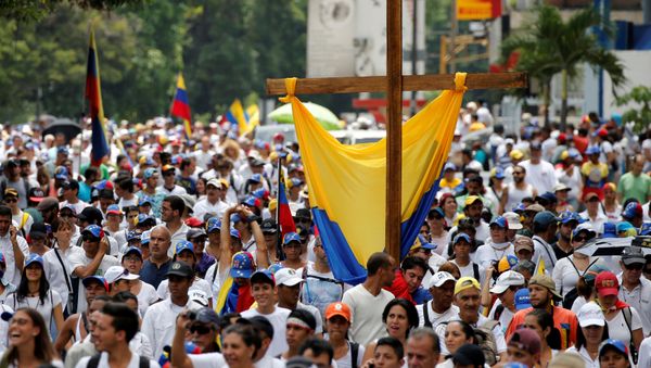 Demonstrators take part in a rally to honour victims of violence during a protest against Venezuela's President Nicolas Maduro's government in Caracas, Venezuela Demonstrators take part in a rally to honour victims of violence during a protest against Venezuela's President Nicolas Maduro's government in Caracas, Venezuela - Sputnik International