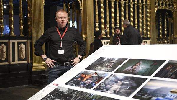 Valery Melnikov, Sputnik photojournalist and winner of multiple leading international photography contests at 2017 World Press Photo exhibition. - Sputnik International