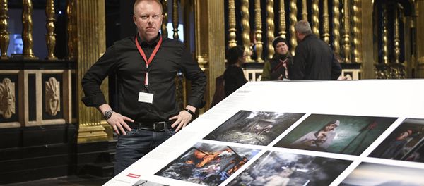 Valery Melnikov, Sputnik photojournalist and winner of multiple leading international photography contests at 2017 World Press Photo exhibition. - Sputnik International