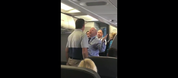 An American Airlines flight attendant gets into a conflict with passengers April 21, 2017. An American Airlines flight attendant gets into a conflict with passengers April 21, 2017. - Sputnik International