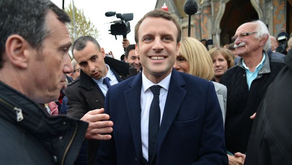 Emmanuel Macron, leader of En Marche! movement, center, is seen here in Le Touquet-Paris-Plage in the Pas-de-Calais department during the first round of the French presidential elections. Emmanuel Macron, leader of En Marche! movement, center, is seen here in Le Touquet-Paris-Plage in the Pas-de-Calais department during the first round of the French presidential elections. - Sputnik International