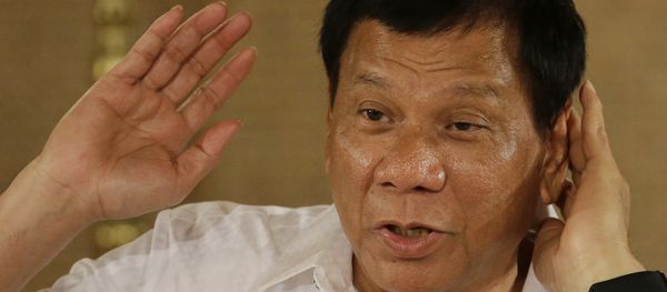 Philippine President Rodrigo Duterte gestures as he answers questions from reporters during a press conference Philippine President Rodrigo Duterte gestures as he answers questions from reporters during a press conference - Sputnik International