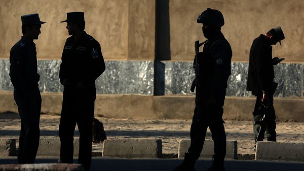 In this Saturday, Feb. 27, 2016 file photo, Afghan National police stand at the site of a suicide attack near the Defense Ministry compound, in Kabul, Afghanistan. In this Saturday, Feb. 27, 2016 file photo, Afghan National police stand at the site of a suicide attack near the Defense Ministry compound, in Kabul, Afghanistan. - Sputnik International