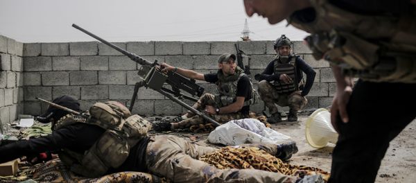 Soldiers with the Iraqi special forces look out on Islamic State group positions from a rooftop in west Mosul as fighting continues, Monday, April 24, 2017 Soldiers with the Iraqi special forces look out on Islamic State group positions from a rooftop in west Mosul as fighting continues, Monday, April 24, 2017 - Sputnik International
