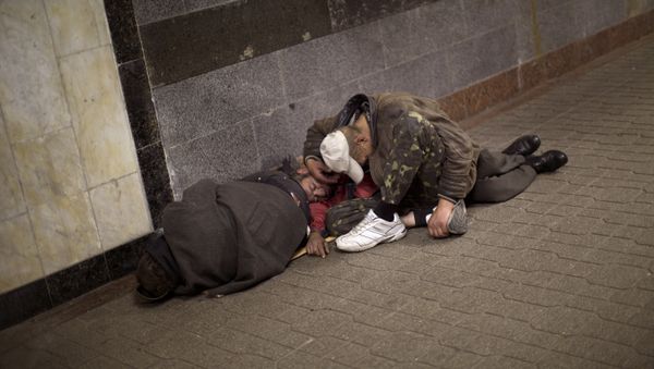 Homeless men sleep inside an underground shopping mall in central Kiev, Ukraine Homeless men sleep inside an underground shopping mall in central Kiev, Ukraine - Sputnik International