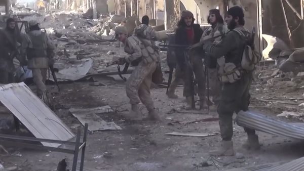 Daesh fighters fire during a a battle against the Syrian government forces, at al-Sinaa neighborhoods, in the oil-rich city of Deir el-Zour, east of Syria (File) - Sputnik International