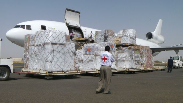 International Committee of the Red Cross workers unload a cargo plane carrying humanitarian relief supplies for civilians at the airport in Sanaa, Yemen (File) International Committee of the Red Cross workers unload a cargo plane carrying humanitarian relief supplies for civilians at the airport in Sanaa, Yemen (File) - Sputnik International