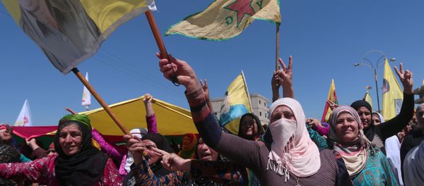 Kurdish women carry flags as they protest, in the northeastern city of Qamishli, against Turkish airstrikes on the headquarters of the Kurdish fighters from the People's Protection Units (YPG) in Mount Karachok on Tuesday, Syria April 26, 2017 Kurdish women carry flags as they protest, in the northeastern city of Qamishli, against Turkish airstrikes on the headquarters of the Kurdish fighters from the People's Protection Units (YPG) in Mount Karachok on Tuesday, Syria April 26, 2017 - Sputnik International