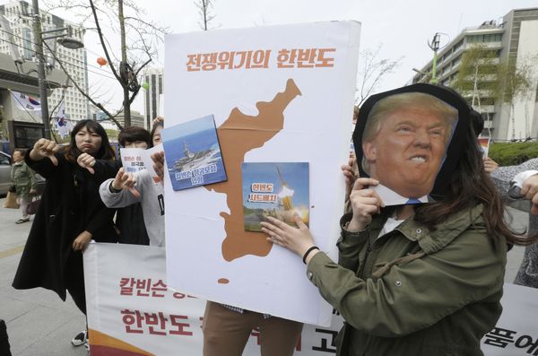 Protesters hold a cutout of US President Donald Trump and images of the USS Carl Vinson aircraft carrier and US missile defense system THAAD, right, on a map of Korean Peninsula during a rally against US deployment of the aircraft carrier to the Korean Peninsula, near the US embassy in Seoul, South Korea, Thursday, April 13, 2017 Protesters hold a cutout of US President Donald Trump and images of the USS Carl Vinson aircraft carrier and US missile defense system THAAD, right, on a map of Korean Peninsula during a rally against US deployment of the aircraft carrier to the Korean Peninsula, near the US embassy in Seoul, South Korea, Thursday, April 13, 2017 - Sputnik International