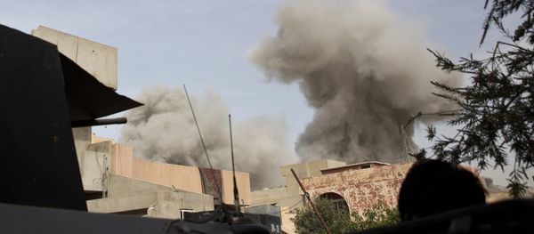 An Iraqi special forces soldier watches the plume of smoke from a coalition airstrike on a car bomb as troops move from the Yarmouk neighborhood to take another district from Islamic State militant control in Mosul, Iraq, Wednesday, April 12, 2017 - Sputnik International