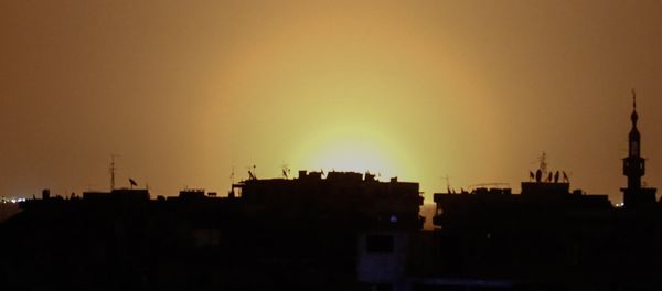 A photo taken from the rebel-held town of Douma shows flames rising in the distance which are believed to be coming from Damascus International Airport following an explosion early in the morning of April 27, 2017 A photo taken from the rebel-held town of Douma shows flames rising in the distance which are believed to be coming from Damascus International Airport following an explosion early in the morning of April 27, 2017 - Sputnik International