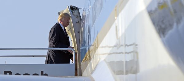 Trump walks up the steps the steps of Air Force One at Palm Beach International Airport in West Palm Beach, Fla. Trump walks up the steps the steps of Air Force One at Palm Beach International Airport in West Palm Beach, Fla. - Sputnik International