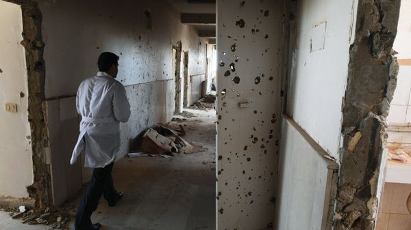 An employee in the corridor of Assad Hospital in Deir ez-Zor, Syria. An employee in the corridor of Assad Hospital in Deir ez-Zor, Syria. - Sputnik International