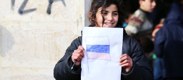 A girl is seen here in the temporary refugee shelter in Jibreen, Aleppo. A girl is seen here in the temporary refugee shelter in Jibreen, Aleppo. - Sputnik International