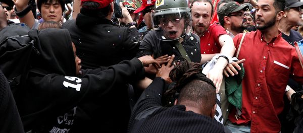 Demonstrators clash with people opposing their rally during a May Day protest in New York City Demonstrators clash with people opposing their rally during a May Day protest in New York City - Sputnik International