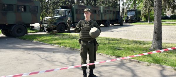 Odessa, Ukraine. A law enforcement officer on Kulikovo Polye Square during a memorial event honoring those killed in a May 2, 2014 fire at the local House of Trade Unions. - Sputnik International
