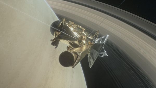 This illustration of NASA's Cassini spacecraft, about to make one of its dives between Saturn and its innermost rings, as part of the mission's grand finale. - Sputnik International