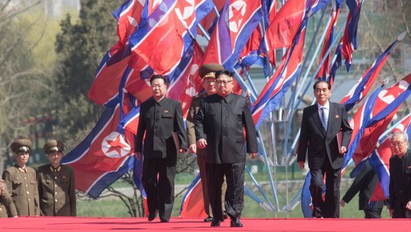 DPRK leader Kim Jong-il, center, at a ceremony to open a new residential area on Ryomyong Street in Pyongyang. - Sputnik International
