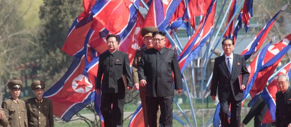 DPRK leader Kim Jong-il, center, at a ceremony to open a new residential area on Ryomyong Street in Pyongyang. - Sputnik International