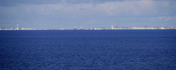 Chinese structures and buildings on the man-made Subi Reef at the Spratlys group of islands are seen 18 kilometers (11 miles) away from the Philippine-claimed Thitu Island off the disputed South China Sea Chinese structures and buildings on the man-made Subi Reef at the Spratlys group of islands are seen 18 kilometers (11 miles) away from the Philippine-claimed Thitu Island off the disputed South China Sea - Sputnik International