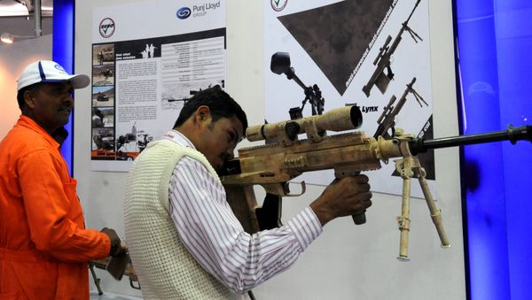 An Indian exhibition visitor takes aim with a Punj Lloyd's Gepard GM6LYNX rifle at the DefExpo 2010 in New Delhi. (File) An Indian exhibition visitor takes aim with a Punj Lloyd's Gepard GM6LYNX rifle at the DefExpo 2010 in New Delhi. (File) - Sputnik International